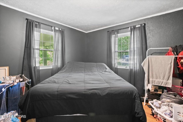 330 Dilbeck Ln, Caryville, TN 37714 - bedroom featuring a textured ceiling, ornamental molding, and wood finished floors