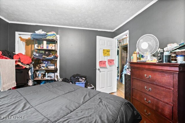 330 Dilbeck Ln, Caryville, TN 37714 - bedroom featuring a textured ceiling, crown molding, and wood finished floors