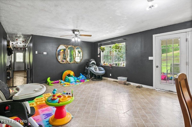 330 Dilbeck Ln, Caryville, TN 37714 - game room featuring a ceiling fan and a textured ceiling