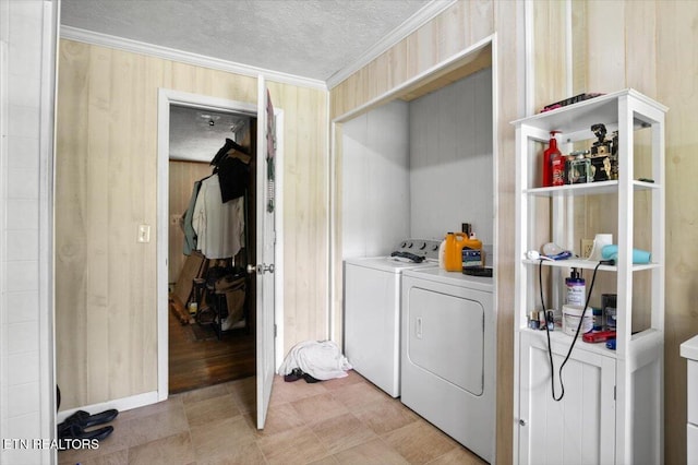330 Dilbeck Ln, Caryville, TN 37714 - laundry area with a textured ceiling, washing machine and dryer, crown molding, and wooden walls