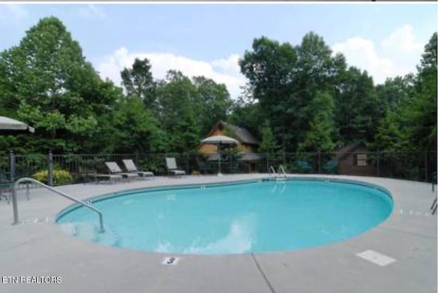 315 Greenwood Way, Pigeon Forge, TN 37863 - community pool featuring a patio
