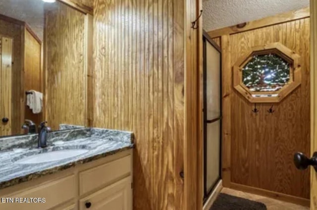 315 Greenwood Way, Pigeon Forge, TN 37863 - full bath with a stall shower, vanity, a textured ceiling, and wood walls