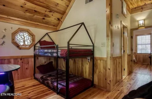 315 Greenwood Way, Pigeon Forge, TN 37863 - bedroom featuring wood ceiling, wood finished floors, a wainscoted wall, wooden walls, and lofted ceiling