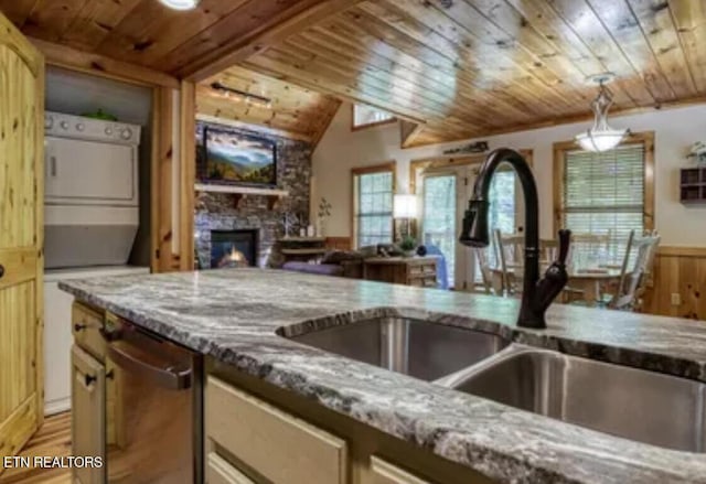 315 Greenwood Way, Pigeon Forge, TN 37863 - kitchen with wood ceiling, dishwasher, light stone counters, a stone fireplace, and light wood-type flooring