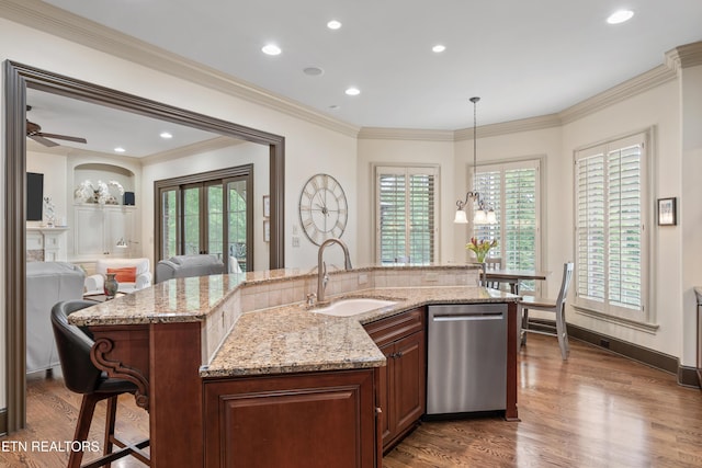 12209 Preston Landing Way, Knoxville, TN 37922 - kitchen with dishwasher, a breakfast bar, dark wood-style floors, decorative light fixtures, and light stone counters