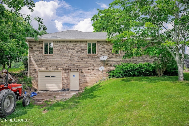 1790 Coon Hunt Rd, Baxter, TN 38544 - back of house with brick siding, an attached garage, and a lawn