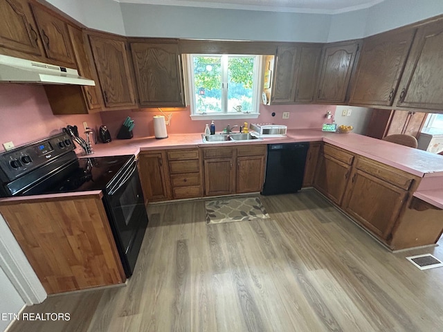1790 Coon Hunt Rd, Baxter, TN 38544 - kitchen featuring black appliances, under cabinet range hood, light wood-style floors, plenty of natural light, and crown molding
