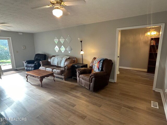1790 Coon Hunt Rd, Baxter, TN 38544 - living area with a ceiling fan, wood finished floors, and a textured ceiling