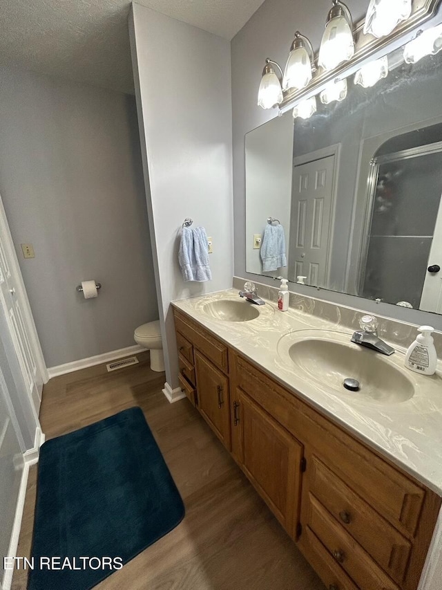 1790 Coon Hunt Rd, Baxter, TN 38544 - bathroom featuring wood finished floors, double vanity, and a shower stall