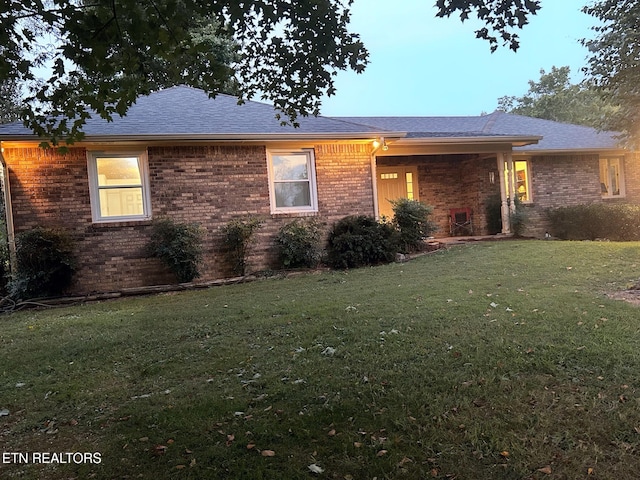 1790 Coon Hunt Rd, Baxter, TN 38544 - view of front of house with brick siding, a front yard, and a shingled roof