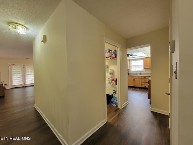 237 Camelot Ct, Knoxville, TN 37922 - hallway featuring dark wood-style flooring and a textured ceiling