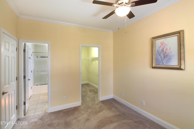 122 Dayflower Way, Maynardville, TN 37807 - unfurnished bedroom featuring crown molding, light carpet, a walk in closet, ensuite bathroom, and a closet