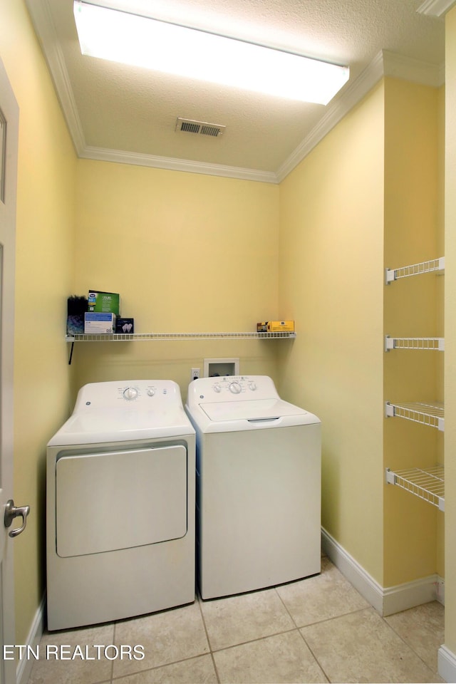 122 Dayflower Way, Maynardville, TN 37807 - laundry area with washer and clothes dryer, crown molding, and tile patterned floors