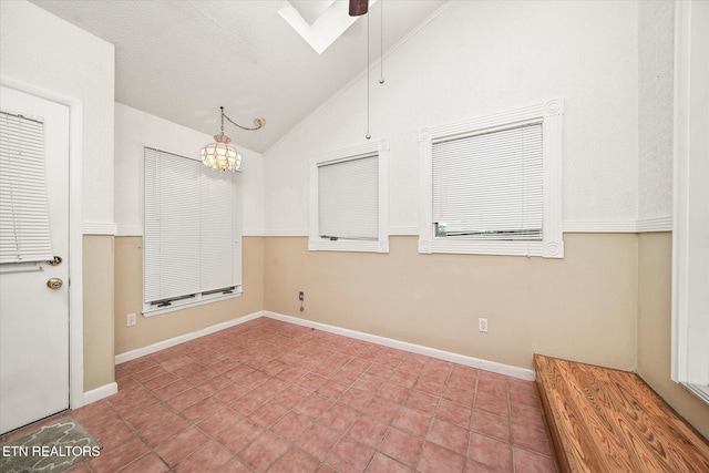 7000 Big Horn Dr Unit C-11, Crossville, TN 38572 - spare room featuring lofted ceiling, a chandelier, and a ceiling fan