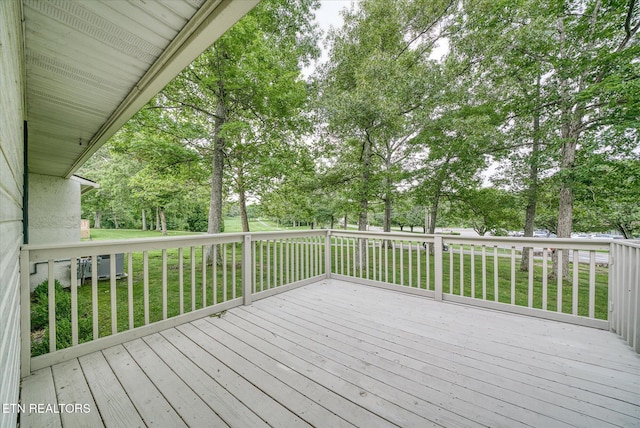 7000 Big Horn Dr Unit C-11, Crossville, TN 38572 - wooden deck with view of wooded area and a lawn