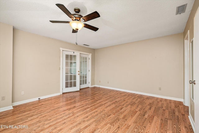 7000 Big Horn Dr Unit C-11, Crossville, TN 38572 - empty room featuring french doors, light wood finished floors, ceiling fan, and a textured ceiling