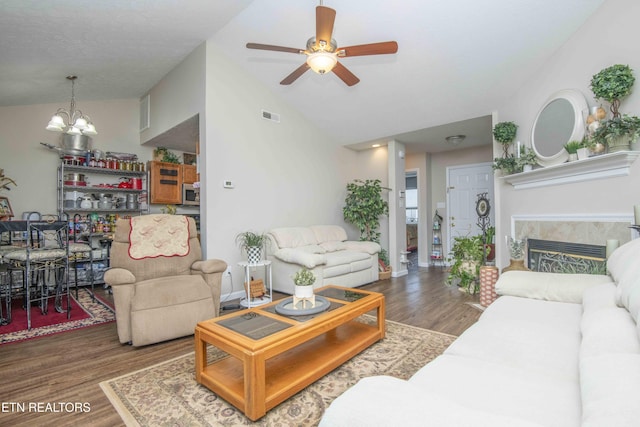 5632 Libby Way, Knoxville, TN 37924 - living area with wood finished floors, a ceiling fan, lofted ceiling, a chandelier, and a tile fireplace