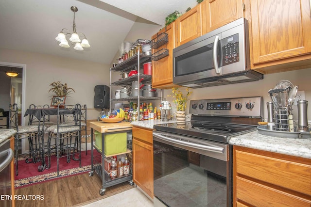 5632 Libby Way, Knoxville, TN 37924 - kitchen with stainless steel appliances, a chandelier, lofted ceiling, and light wood finished floors