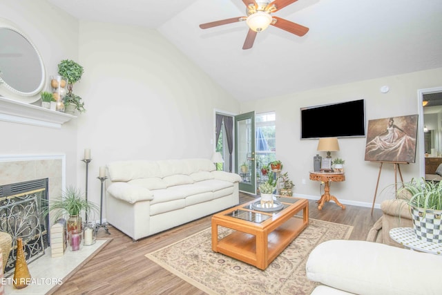 5632 Libby Way, Knoxville, TN 37924 - living area with wood finished floors, a ceiling fan, lofted ceiling, and a fireplace