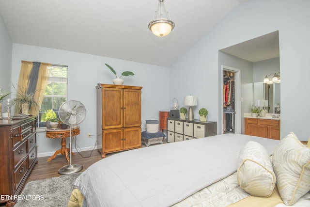 5632 Libby Way, Knoxville, TN 37924 - bedroom with wood finished floors, a spacious closet, vaulted ceiling, a closet, and ensuite bathroom