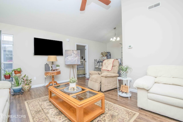 5632 Libby Way, Knoxville, TN 37924 - living room featuring ceiling fan, wood finished floors, lofted ceiling, and a chandelier