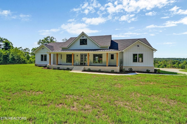 320 Ridge Ln, Monterey, TN 38574 - modern farmhouse with board and batten siding, covered porch, a standing seam roof, roof with shingles, and a front yard