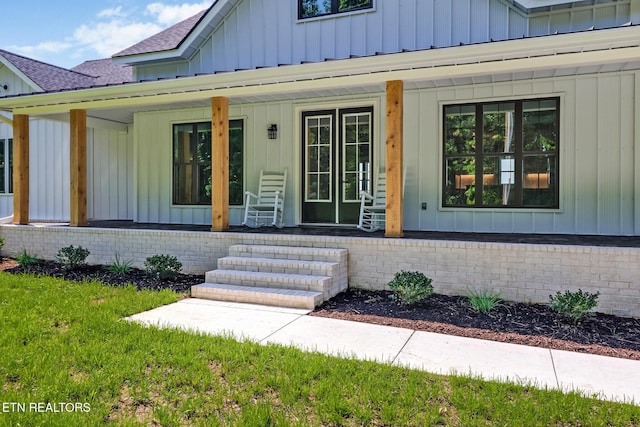320 Ridge Ln, Monterey, TN 38574 - view of exterior entry featuring board and batten siding, covered porch, and roof with shingles