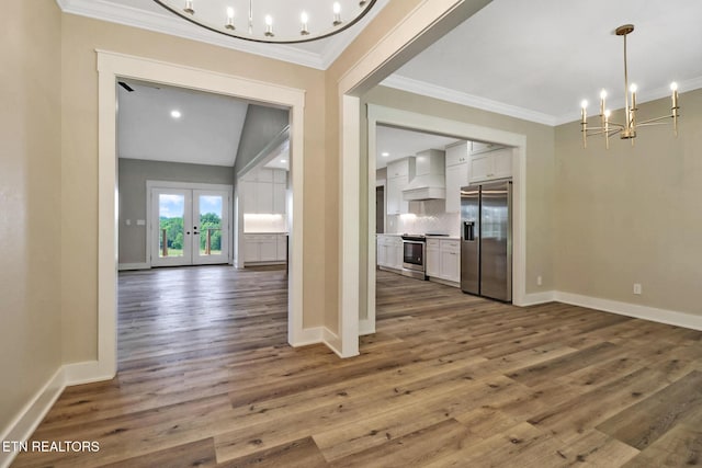 320 Ridge Ln, Monterey, TN 38574 - unfurnished dining area with a chandelier, french doors, dark wood finished floors, and crown molding