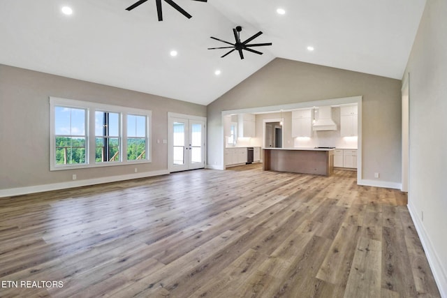 320 Ridge Ln, Monterey, TN 38574 - unfurnished living room featuring ceiling fan, high vaulted ceiling, recessed lighting, light wood-type flooring, and french doors