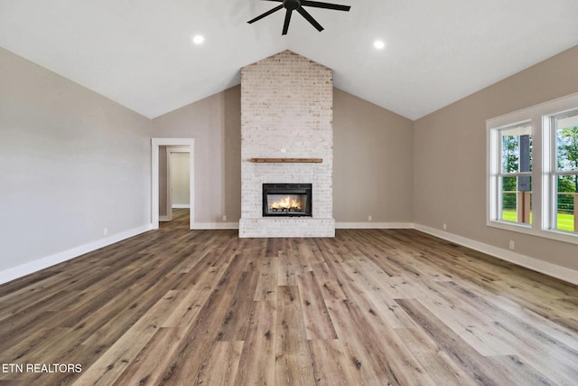 320 Ridge Ln, Monterey, TN 38574 - unfurnished living room featuring ceiling fan, vaulted ceiling, wood finished floors, a fireplace, and recessed lighting