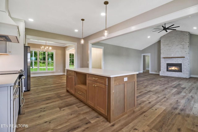 320 Ridge Ln, Monterey, TN 38574 - kitchen with premium range hood, freestanding refrigerator, dark wood finished floors, a fireplace, and ceiling fan