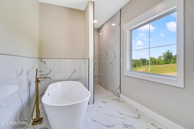 320 Ridge Ln, Monterey, TN 38574 - bathroom with a freestanding bath, a marble finish shower, marble tiled flooring, healthy amount of natural light, and tile walls