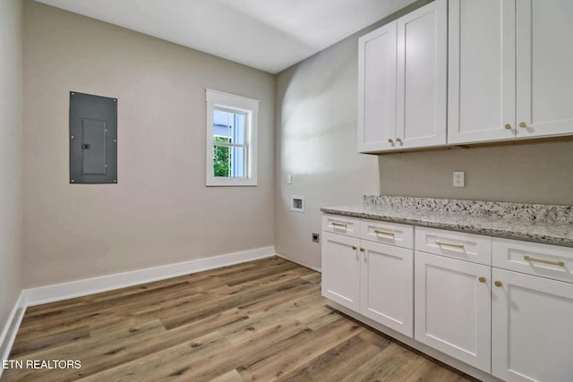 320 Ridge Ln, Monterey, TN 38574 - laundry room with electric panel, cabinet space, hookup for a washing machine, light wood finished floors, and electric dryer hookup