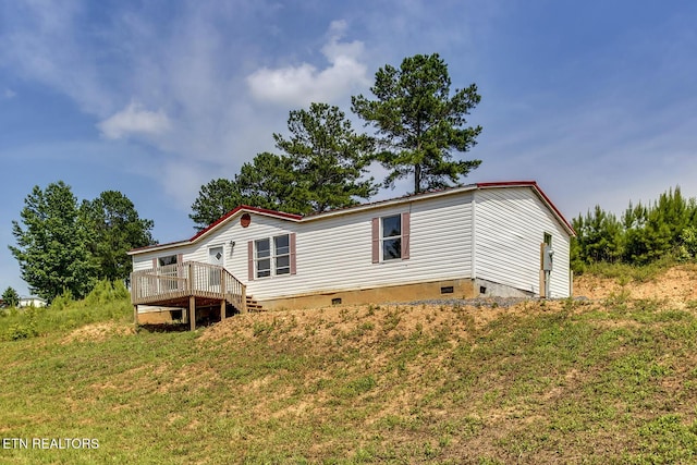 6952 Cottonport Rd, Decatur, TN 37322 - rear view of house featuring crawl space, a deck, and a lawn