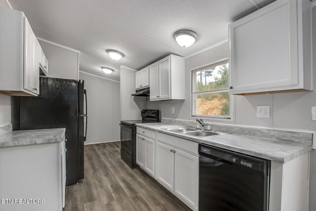 6952 Cottonport Rd, Decatur, TN 37322 - kitchen with black appliances, under cabinet range hood, white cabinetry, light countertops, and a textured ceiling