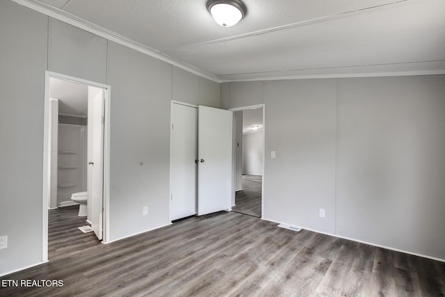 6952 Cottonport Rd, Decatur, TN 37322 - unfurnished bedroom with ornamental molding, wood finished floors, and connected bathroom