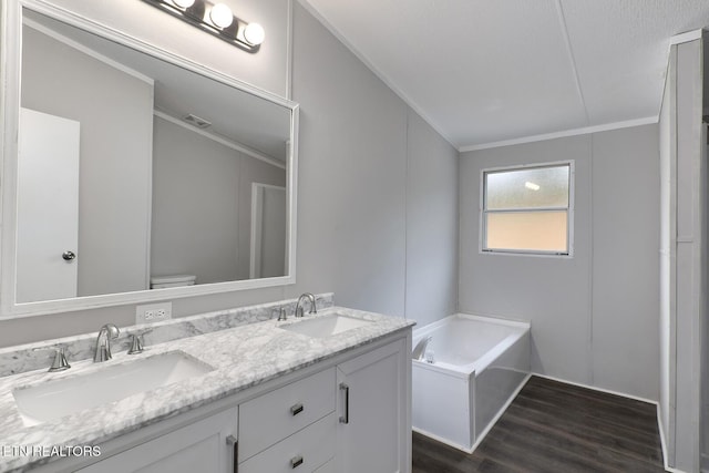 6952 Cottonport Rd, Decatur, TN 37322 - full bathroom featuring ornamental molding, double vanity, a bath, and wood finished floors