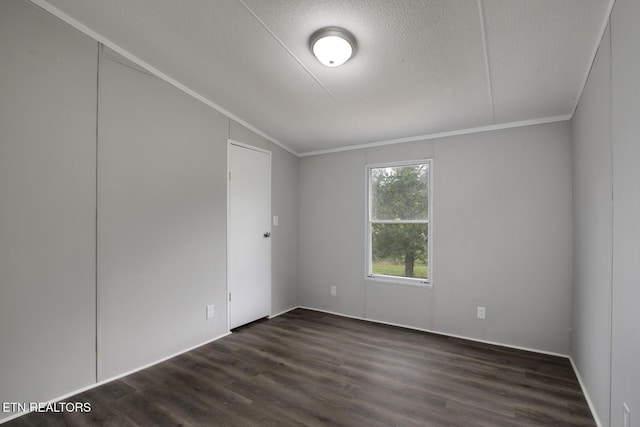 6952 Cottonport Rd, Decatur, TN 37322 - spare room featuring dark wood-style floors, a textured ceiling, and crown molding