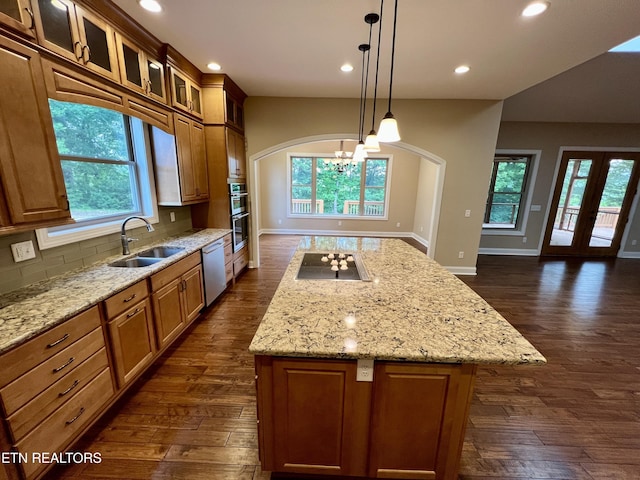 2005 River Mist Cir, New Market, TN 37820 - kitchen with stainless steel appliances, dark wood-style flooring, a chandelier, a kitchen island, and tasteful backsplash