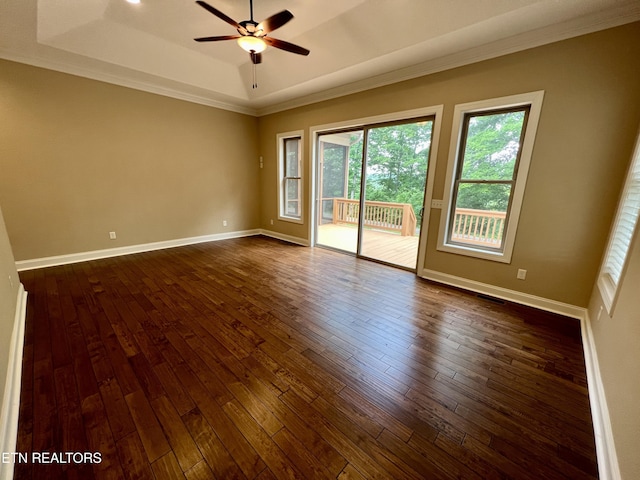 2005 River Mist Cir, New Market, TN 37820 - empty room featuring ceiling fan, a tray ceiling, dark wood-style flooring, and ornamental molding