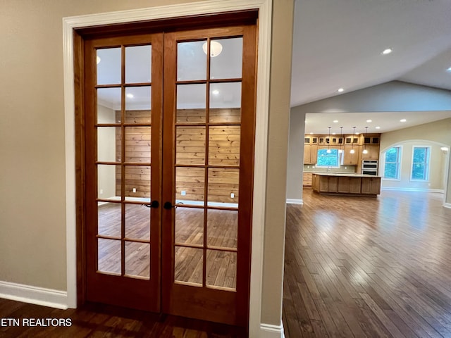 2005 River Mist Cir, New Market, TN 37820 - doorway to outside featuring french doors, dark wood-style flooring, lofted ceiling, and arched walkways