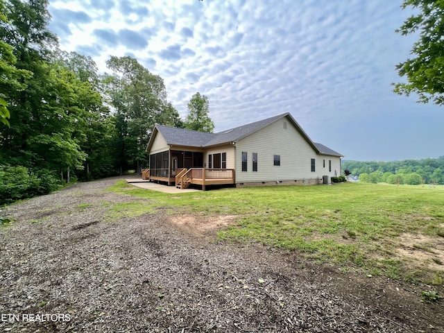 2005 River Mist Cir, New Market, TN 37820 - view of home's exterior with a sunroom, crawl space, gravel driveway, a yard, and a deck