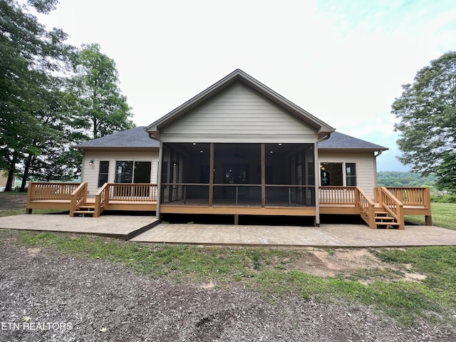 2005 River Mist Cir, New Market, TN 37820 - rear view of house with a sunroom, a wooden deck, and a patio area