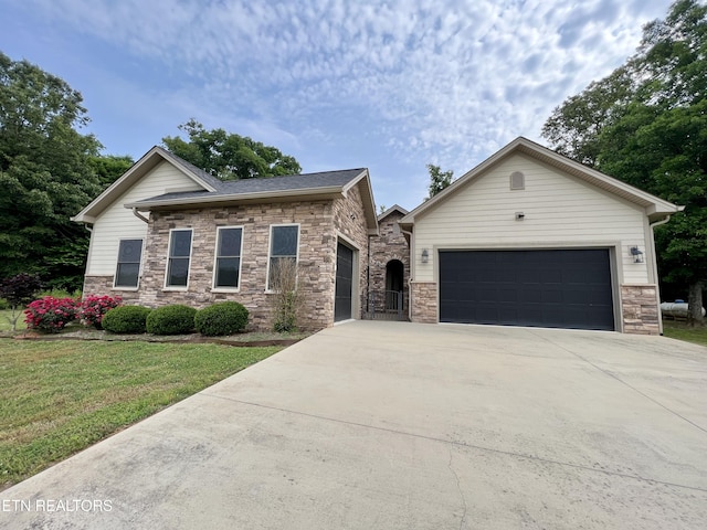 2005 River Mist Cir, New Market, TN 37820 - view of front of property featuring an attached garage, driveway, stone siding, and a front yard