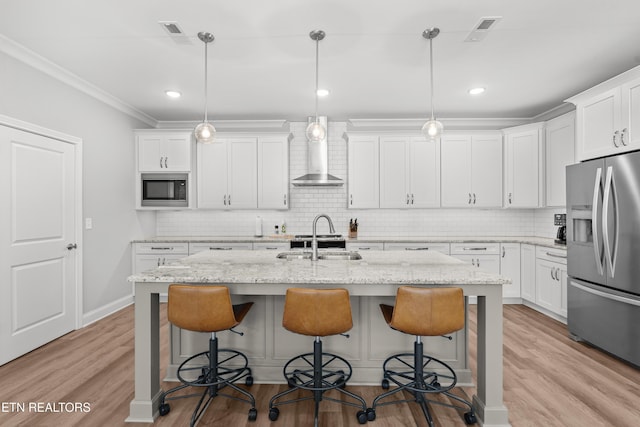 402 Sycamore Pl, Loudon, TN 37774 - kitchen with stainless steel fridge with ice dispenser, wall chimney exhaust hood, built in microwave, a breakfast bar, and a kitchen island with sink