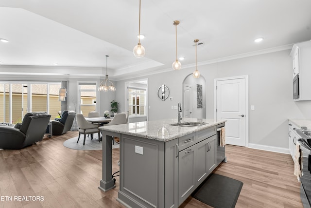 402 Sycamore Pl, Loudon, TN 37774 - kitchen with gray cabinets, light wood-type flooring, ornamental molding, an island with sink, and open floor plan