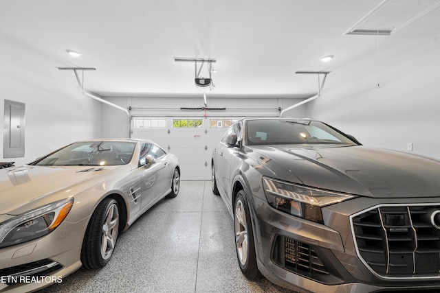 402 Sycamore Pl, Loudon, TN 37774 - garage featuring electric panel and a garage door opener