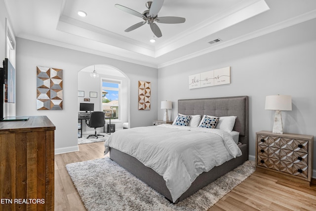 402 Sycamore Pl, Loudon, TN 37774 - bedroom with a raised ceiling, light wood-style flooring, an office area, recessed lighting, and arched walkways