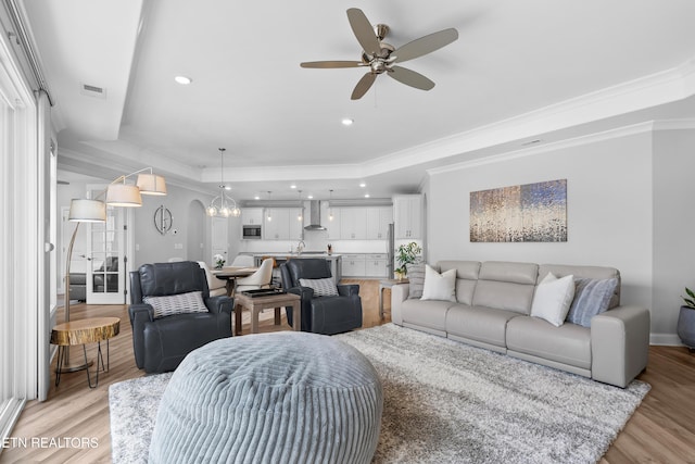 402 Sycamore Pl, Loudon, TN 37774 - living area featuring a raised ceiling, ornamental molding, light wood finished floors, a ceiling fan, and recessed lighting