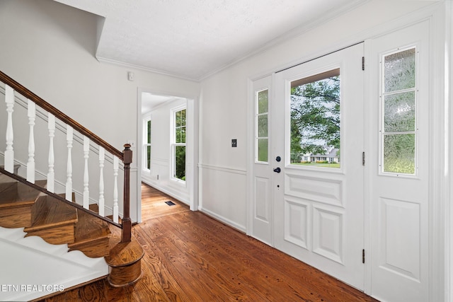 824 W Woodchase Rd, Knoxville, TN 37934 - entryway with wood finished floors, stairs, and ornamental molding